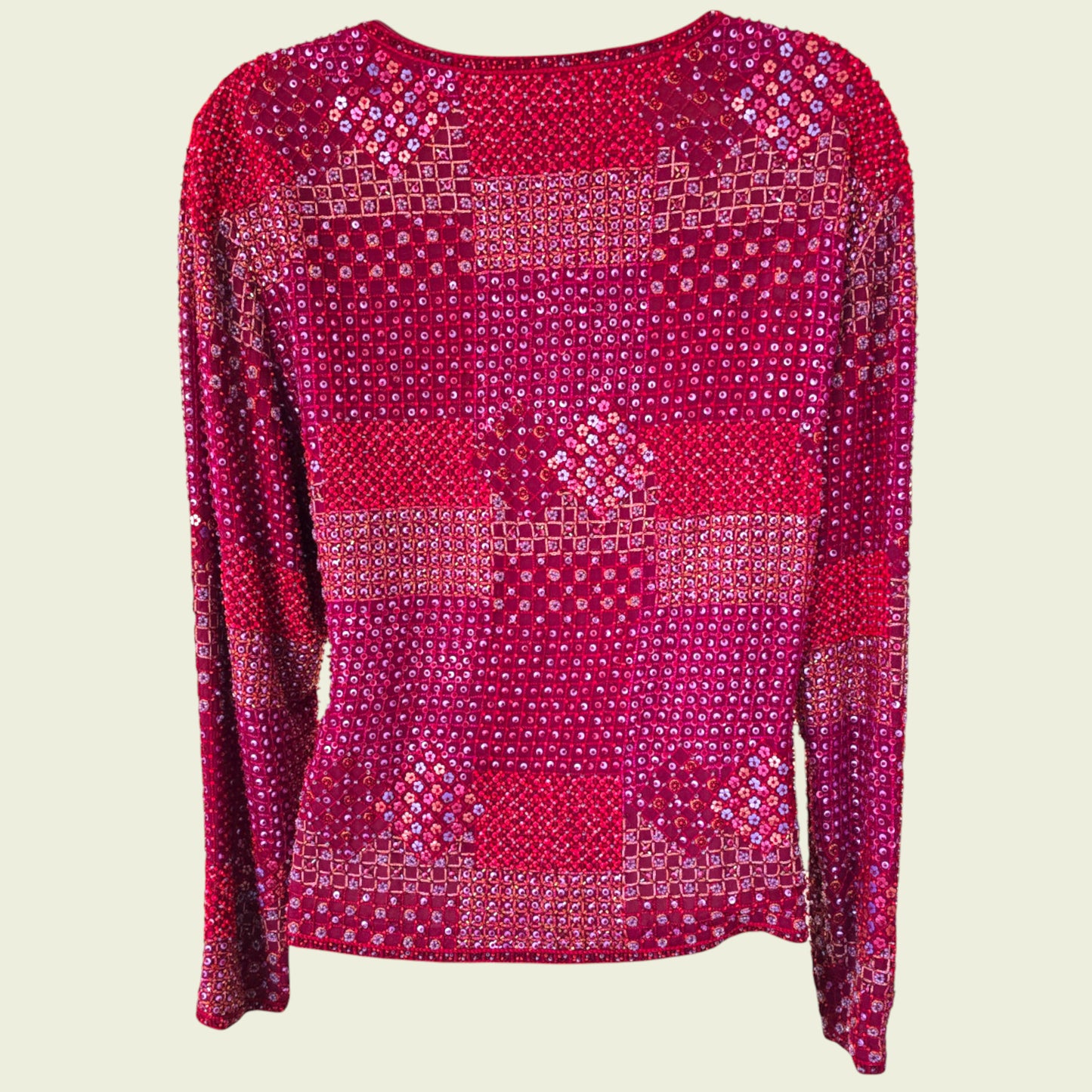 Red sequin jacket on a beige background