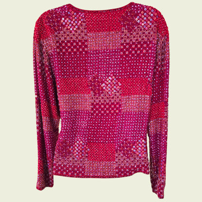 Red sequin jacket on a beige background