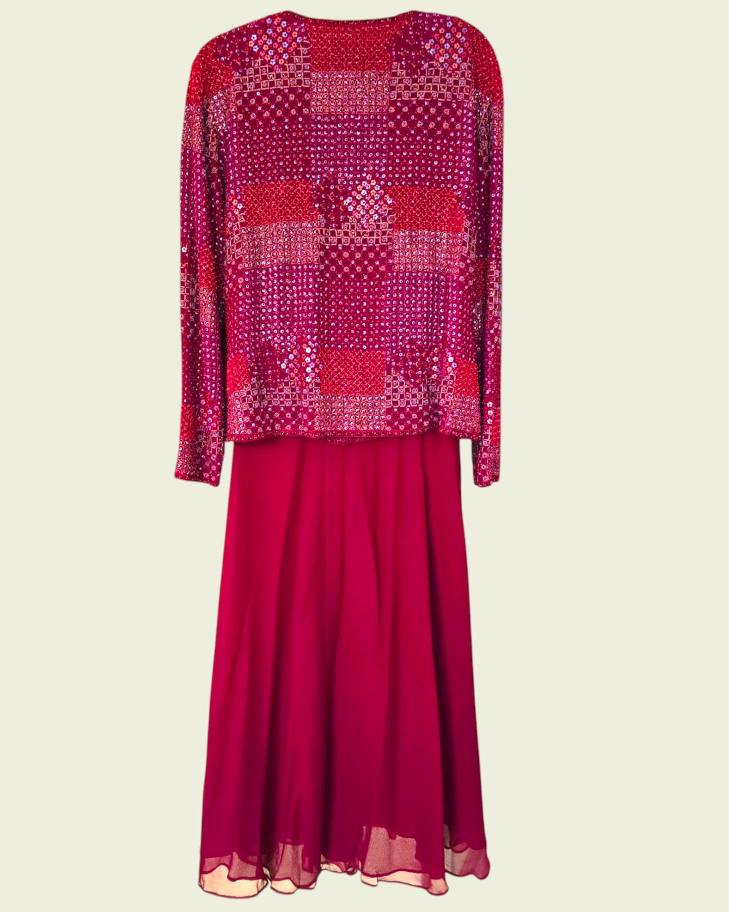 Red patterned top and skirt set on a beige background