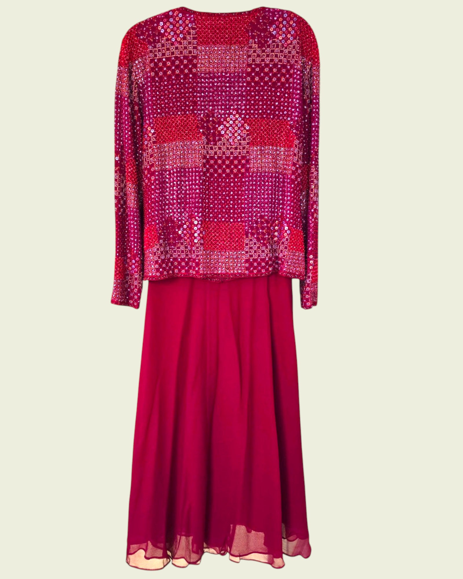 Red patterned top and skirt set on a beige background