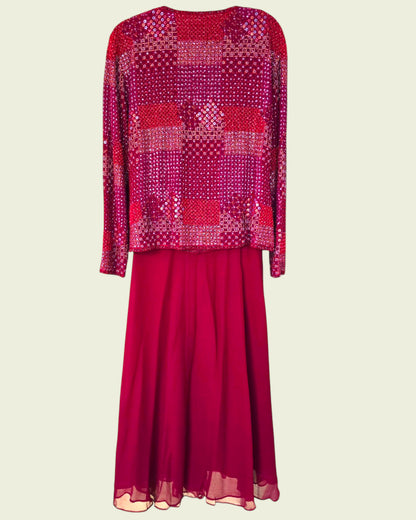 Red patterned top and skirt set on a beige background