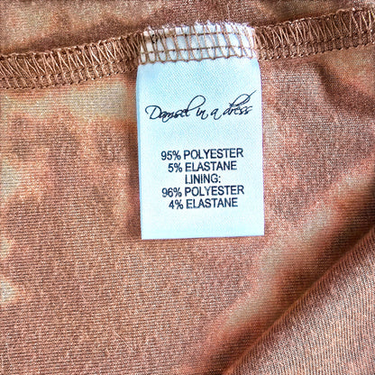 Fabric label with material information on a brown fabric background