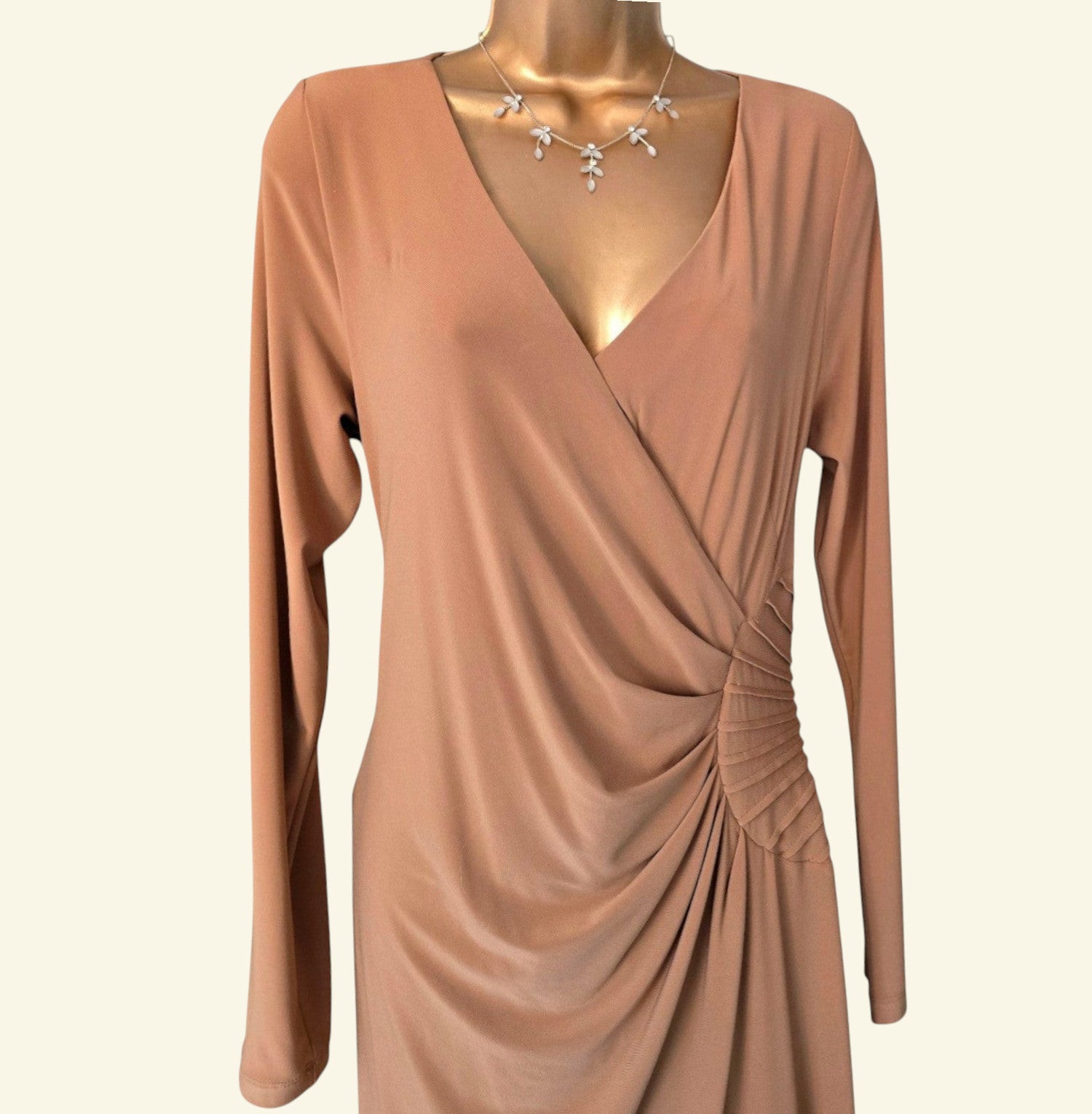 Brown dress on a mannequin with a plain background