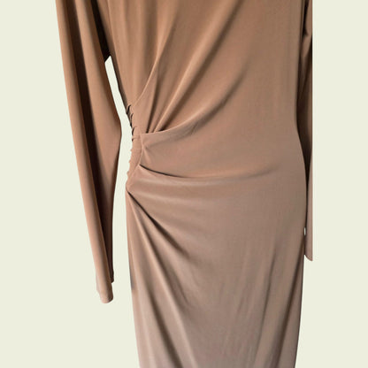 Brown long-sleeve top on a beige background