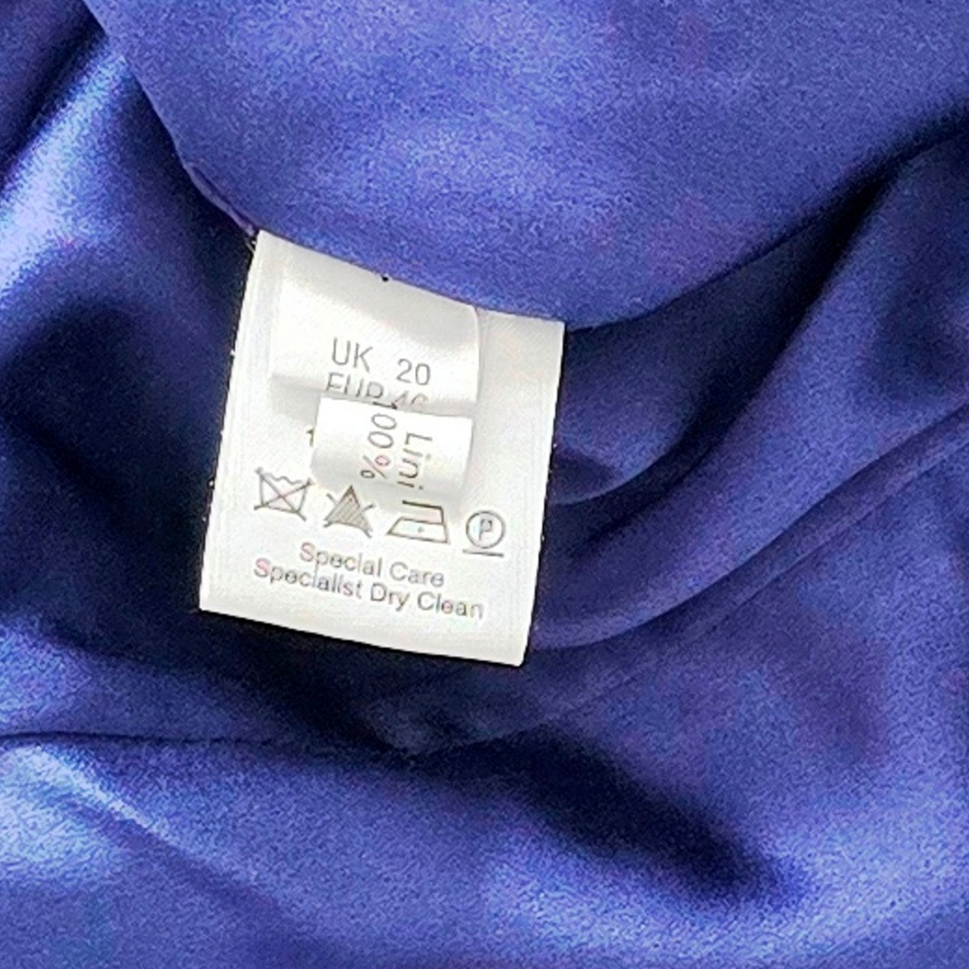 Clothing label on a blue fabric background