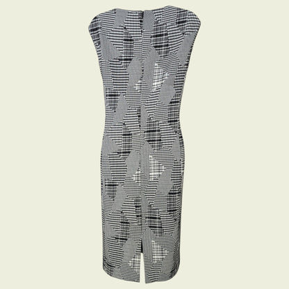 Black and white patterned sleeveless dress on a beige background