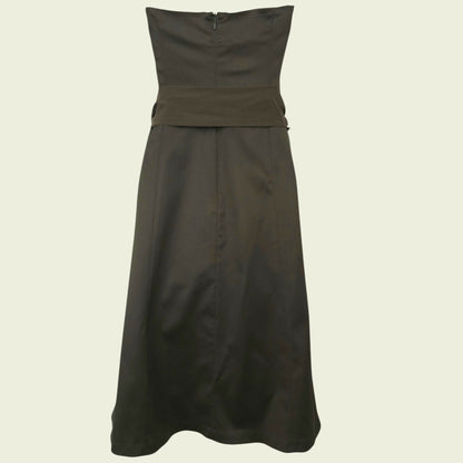 Mannequin wearing an olive green dress on beige background