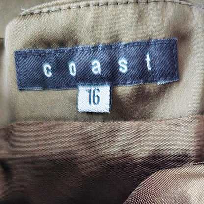 Garment label showing Coast and size on green background
