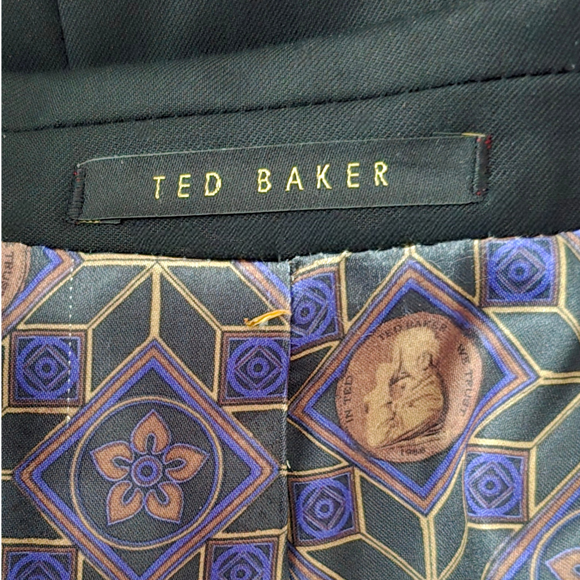 Ted Baker tie with geometric pattern and brand label