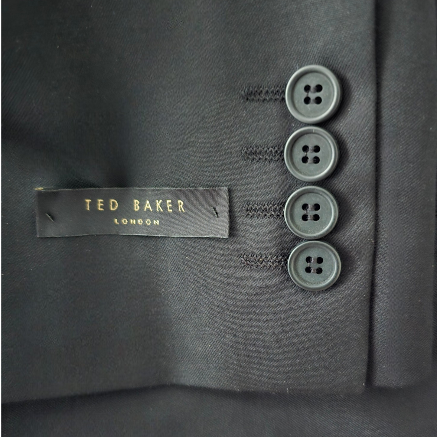 Dark blue suit jacket with Ted Baker label and buttons