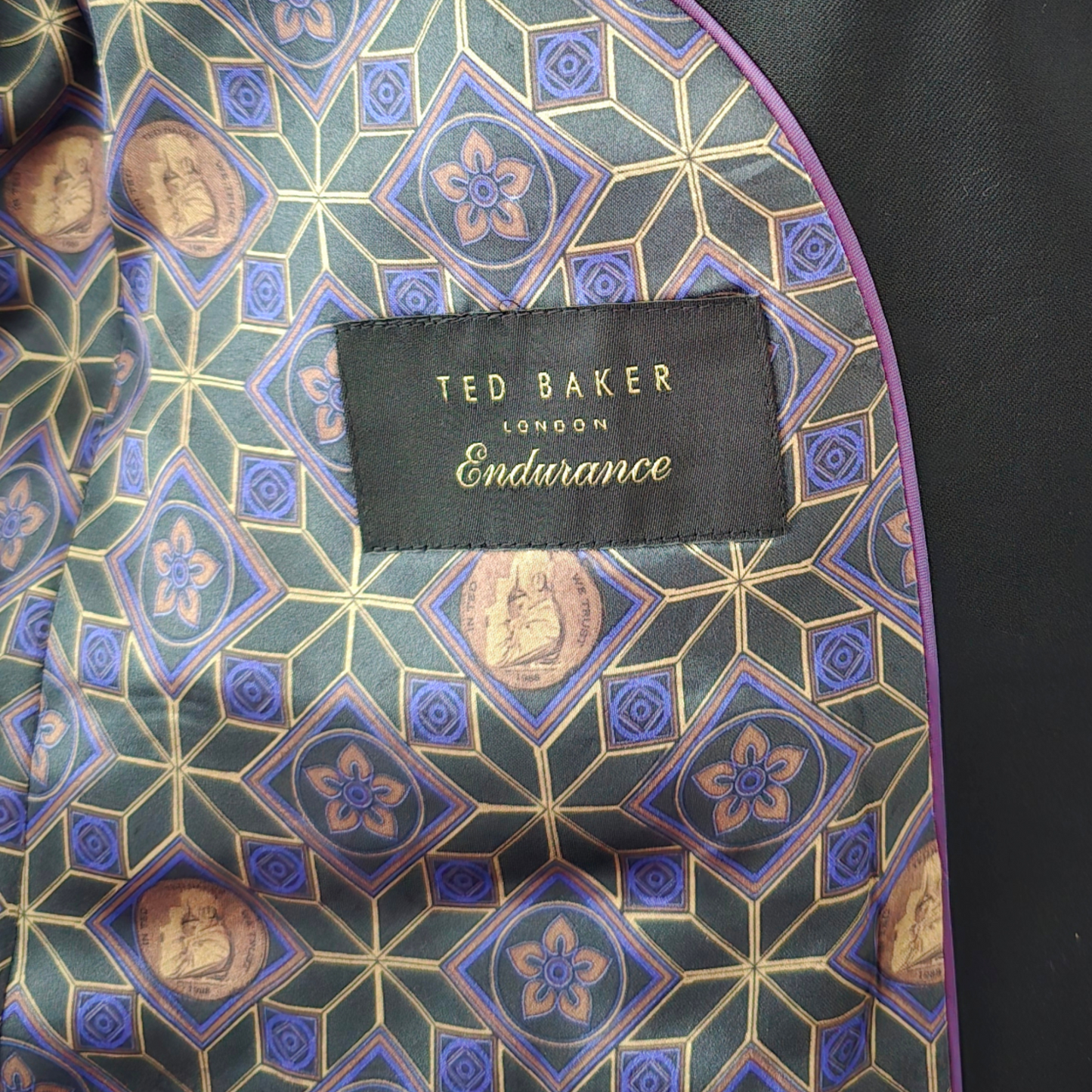 Ted Baker London jacket with geometric pattern and brand label