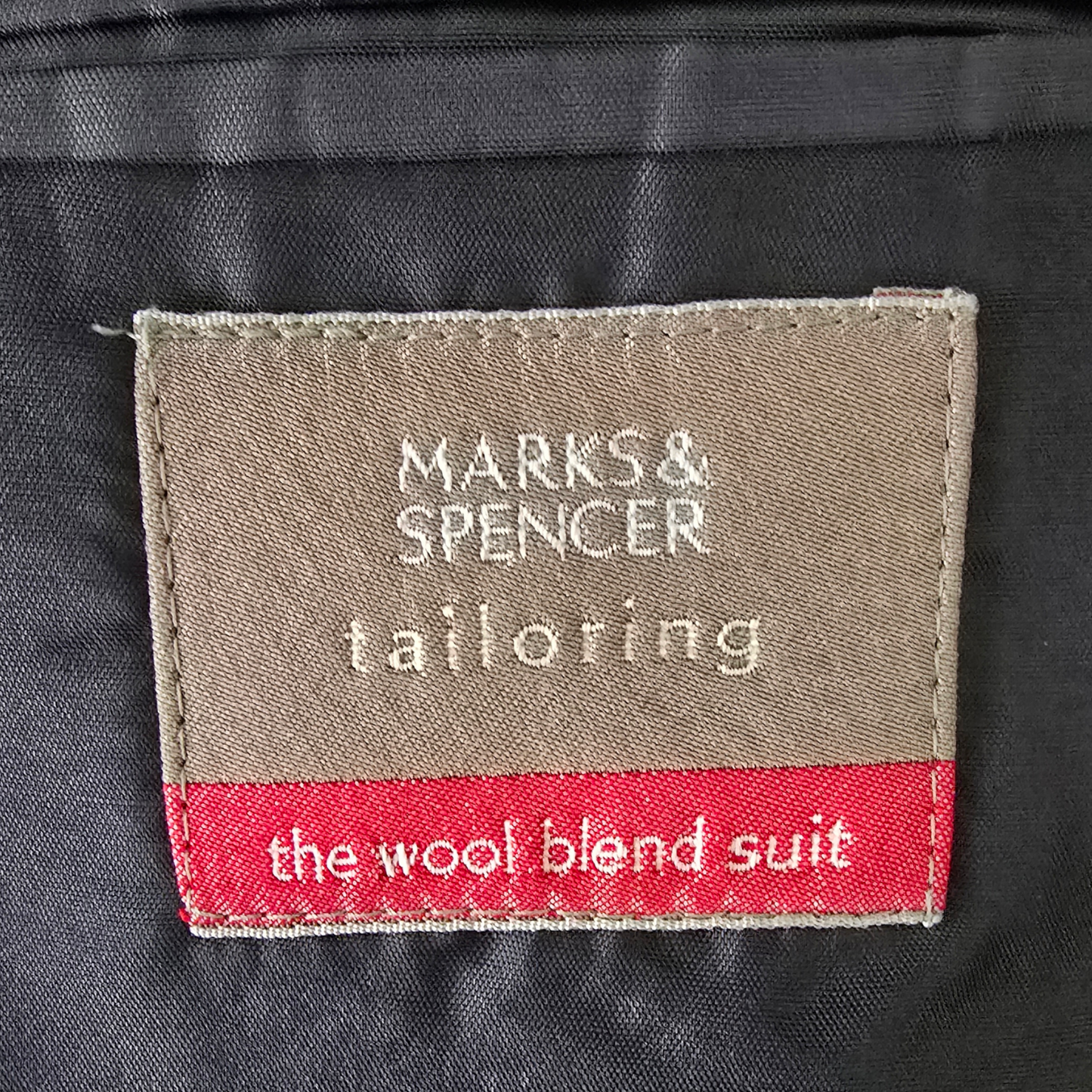 Marks & Spencer tailoring label on a wool blend suit