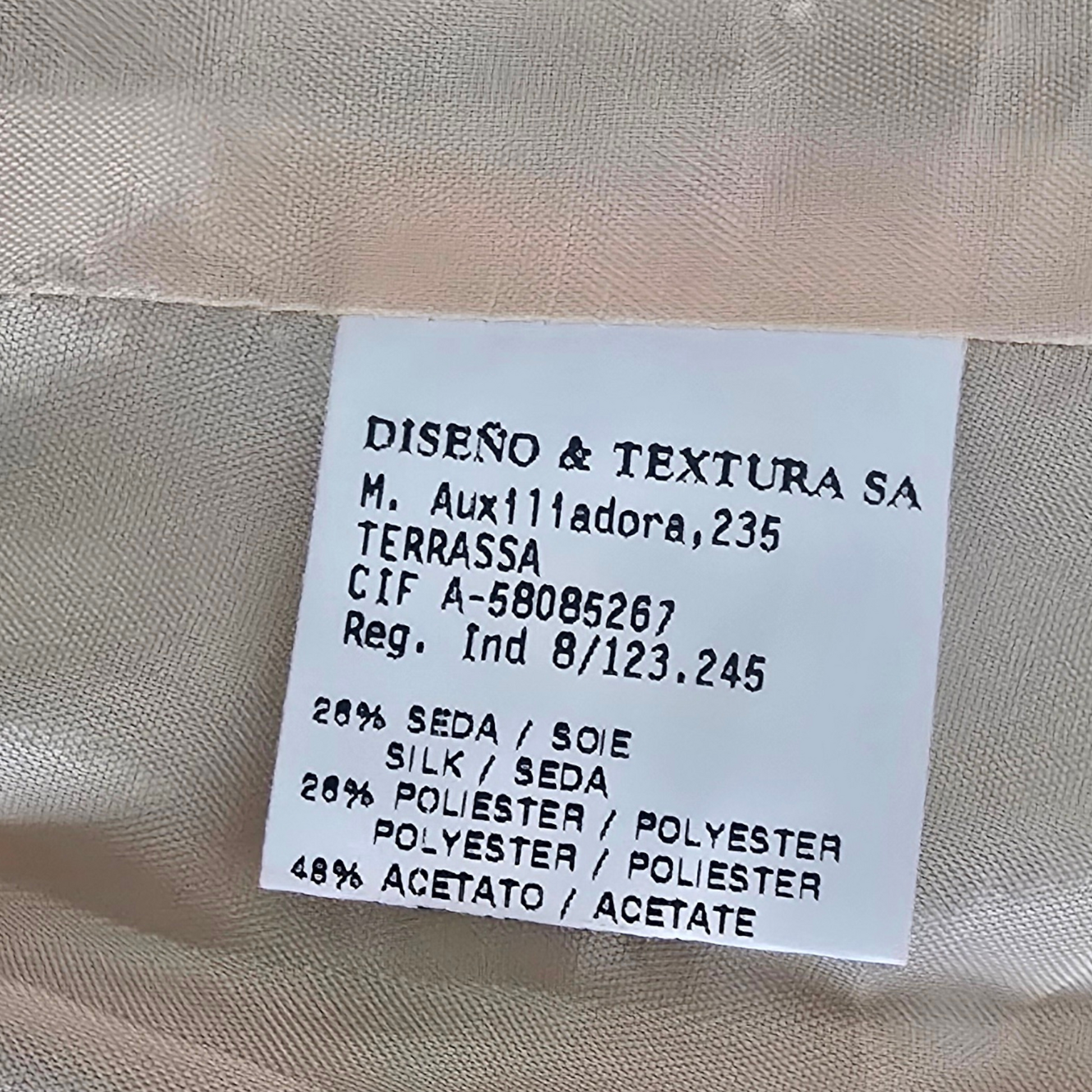 Clothing label on a beige background