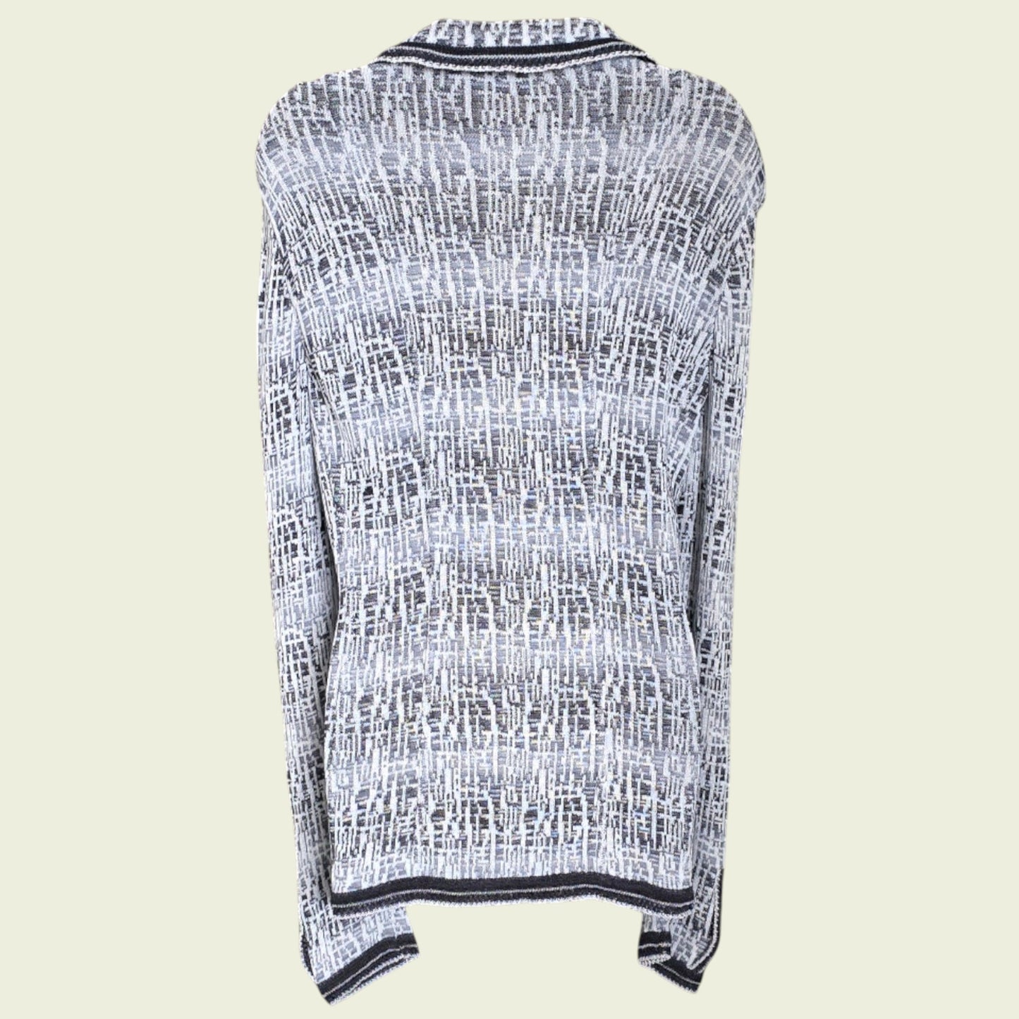 Mannequin wearing blue and white knitted jacket on a beige background