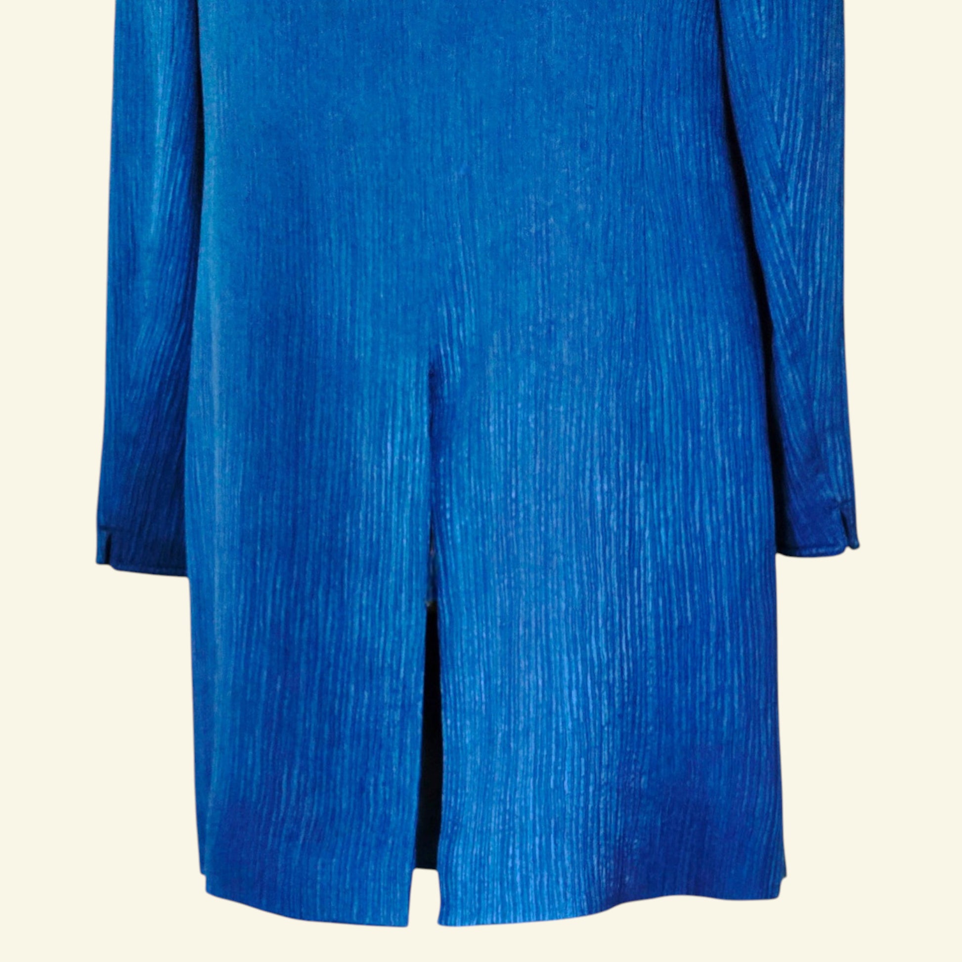 Blue coat on a beige background