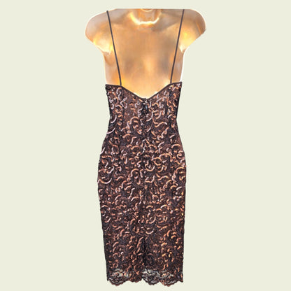 Sequinned dress on a mannequin against a beige background