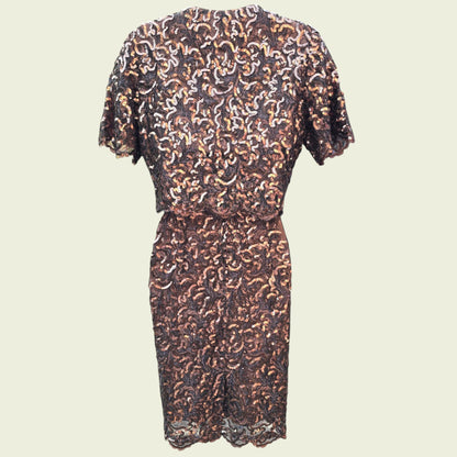 Sequinned dress and bolero on a beige background