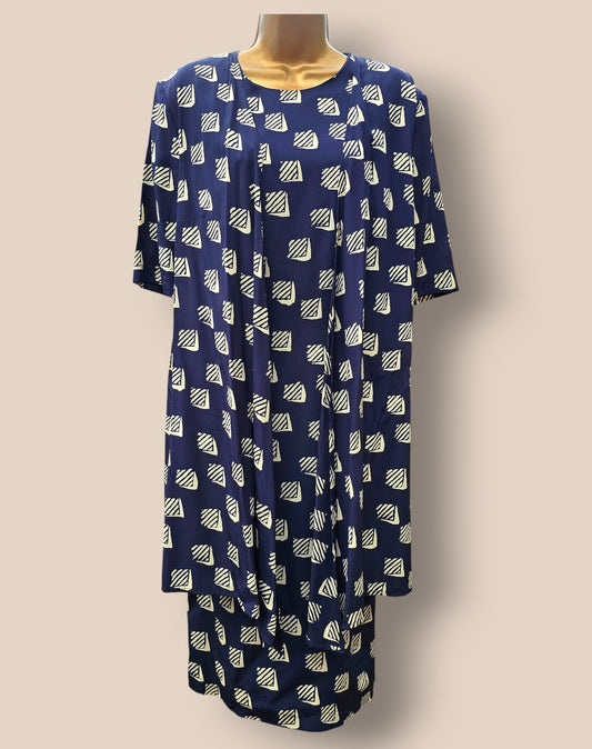 Navy blue dress with white geometric pattern on a beige background
