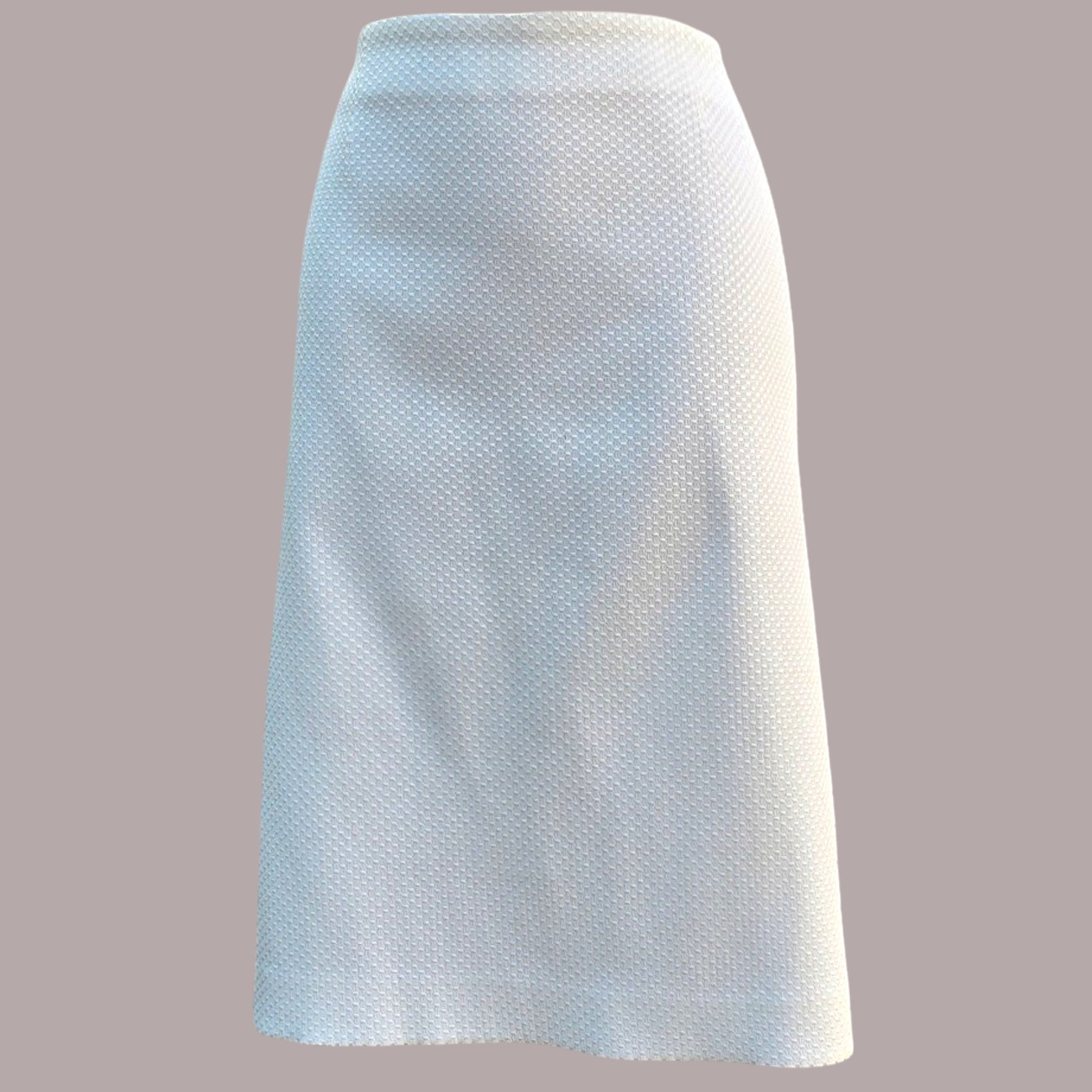 White textured skirt on a gray background