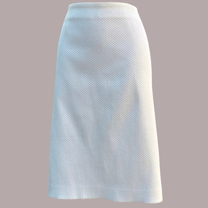 White textured skirt on a gray background