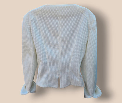 White textured jacket on a beige background