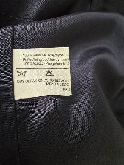 Clothing label on a dark fabric background