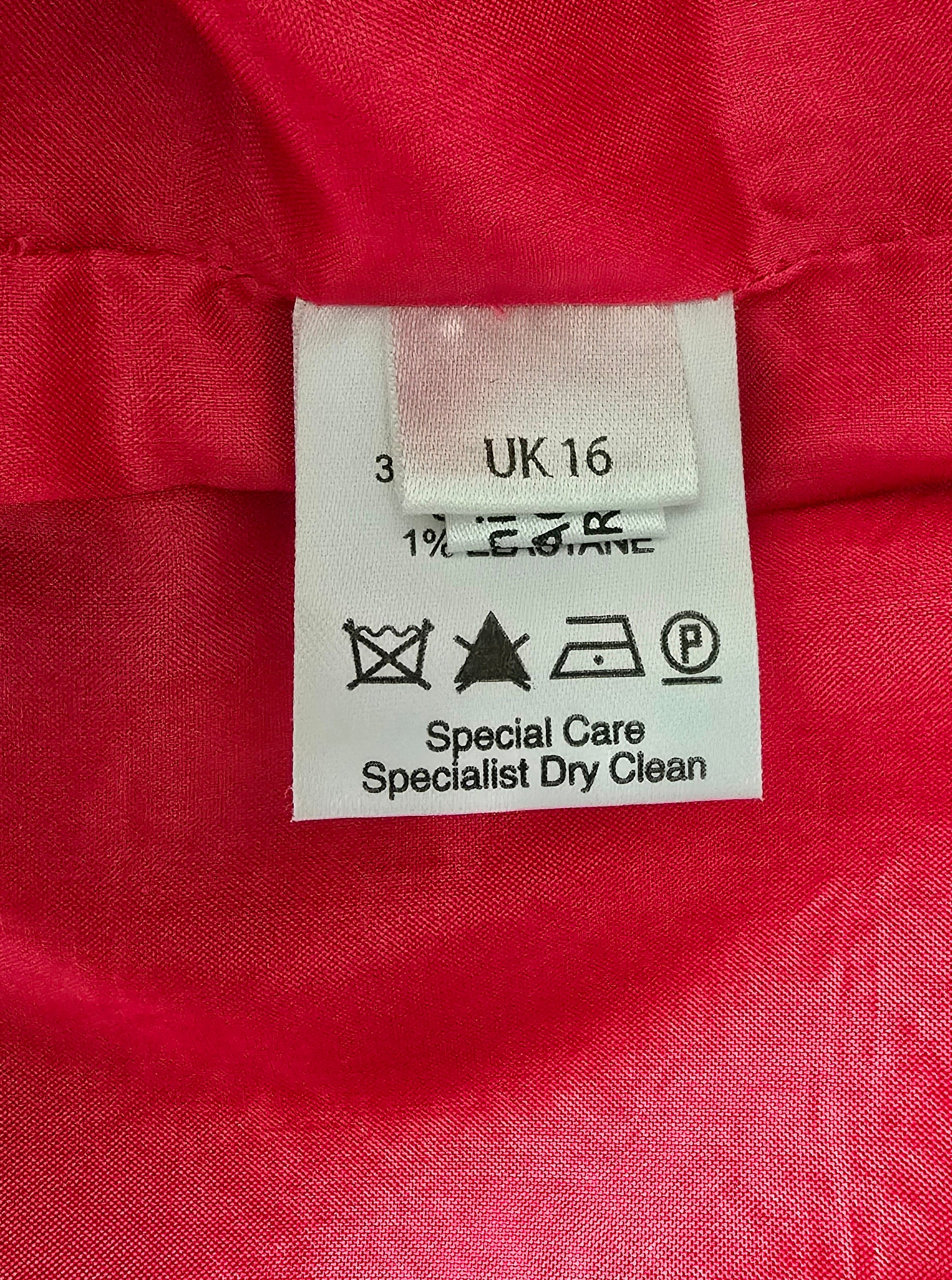 Clothing label on a red fabric background