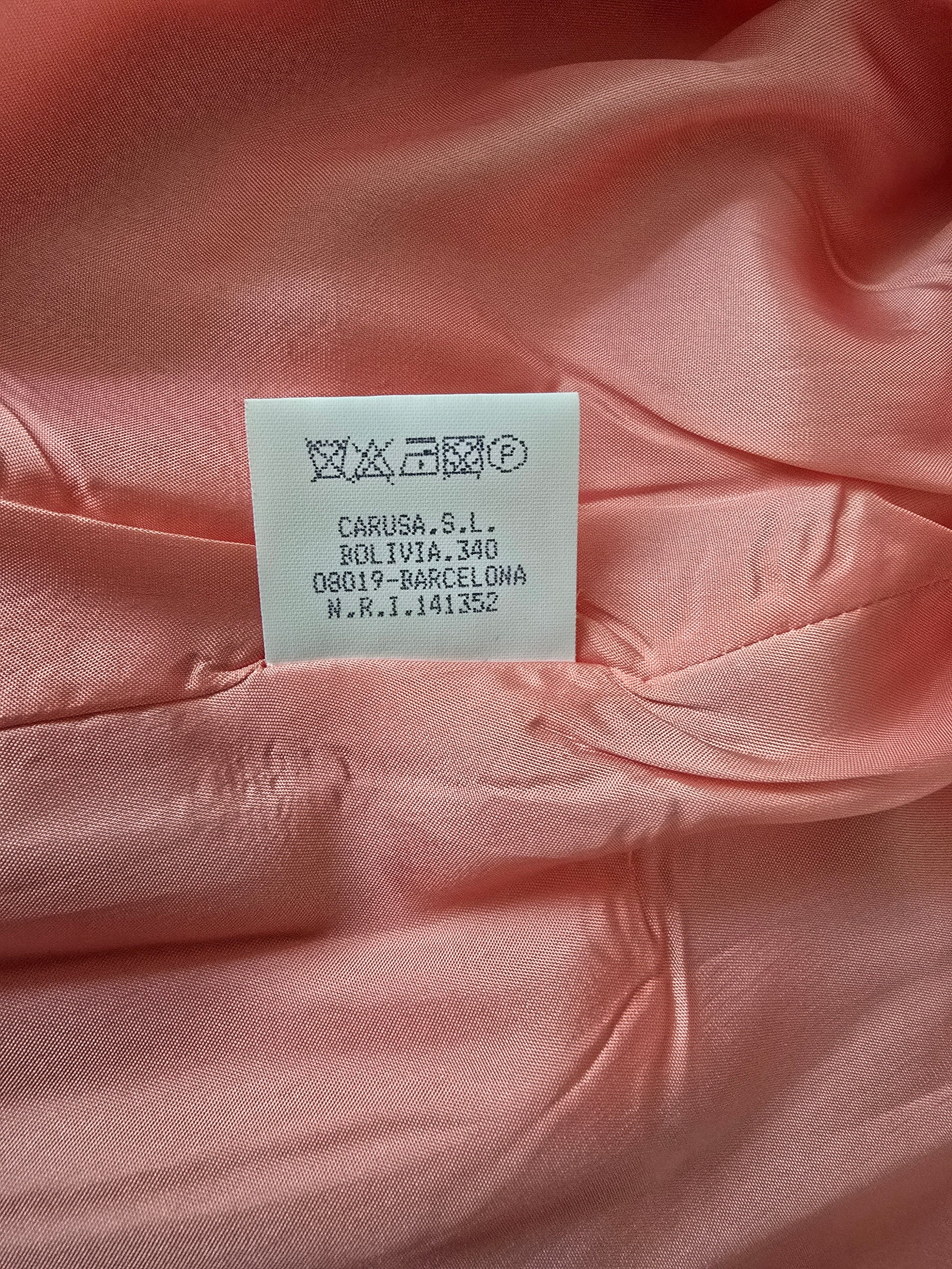 Close-up of a pink fabric with a label on it