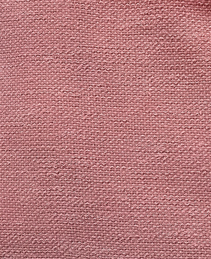 Close-up of a textured pink fabric surface