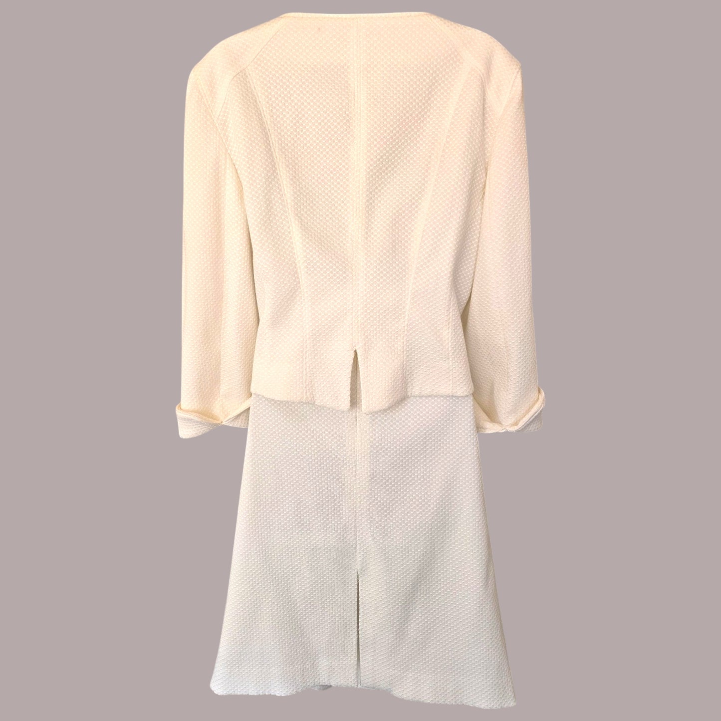 Light-colored suit with a subtle pattern on a gray background