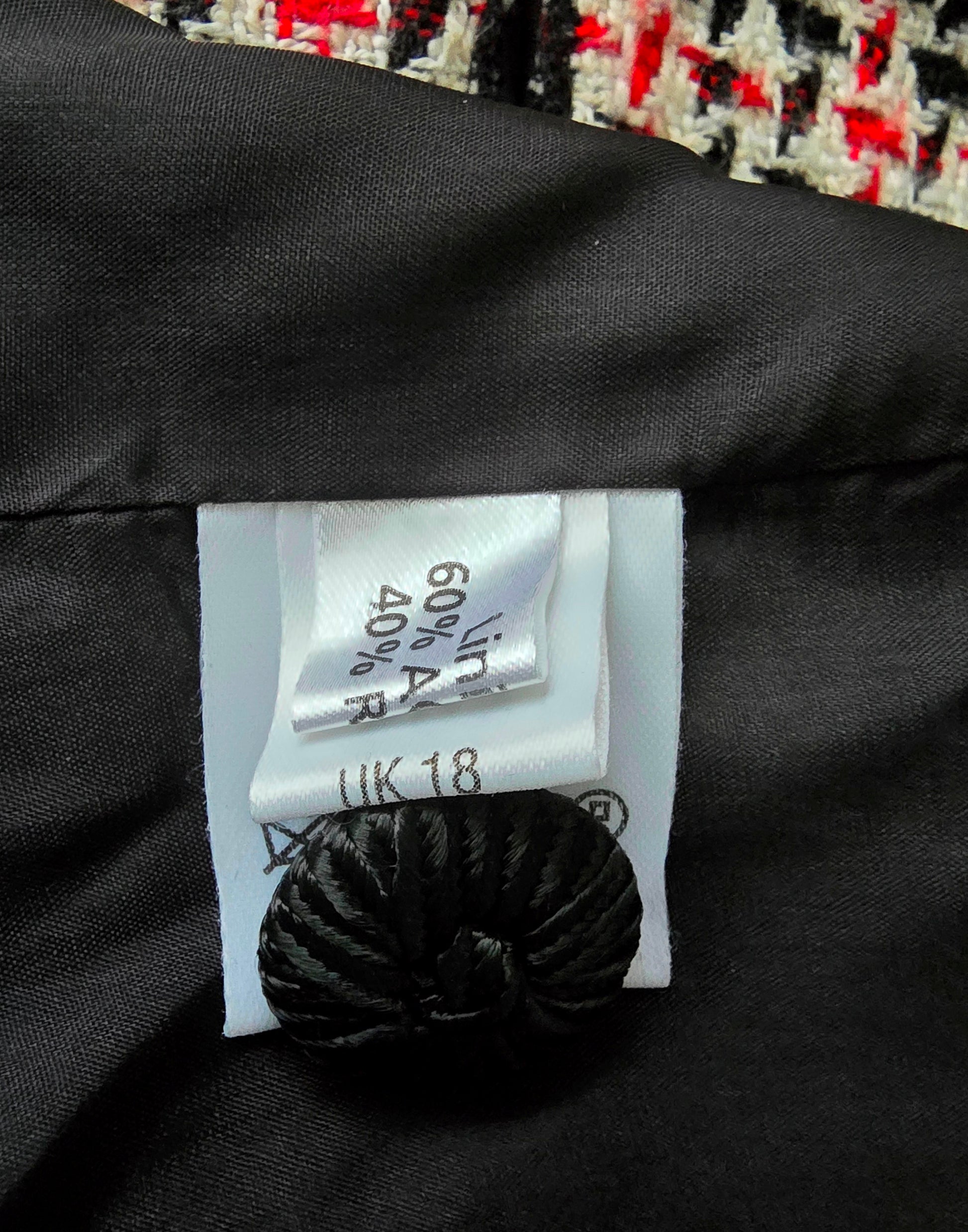 Clothing tag on a black fabric background