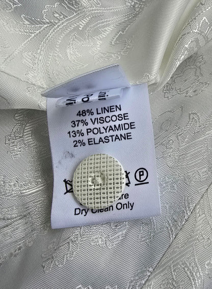 Fabric tag with material composition details on a textured fabric background