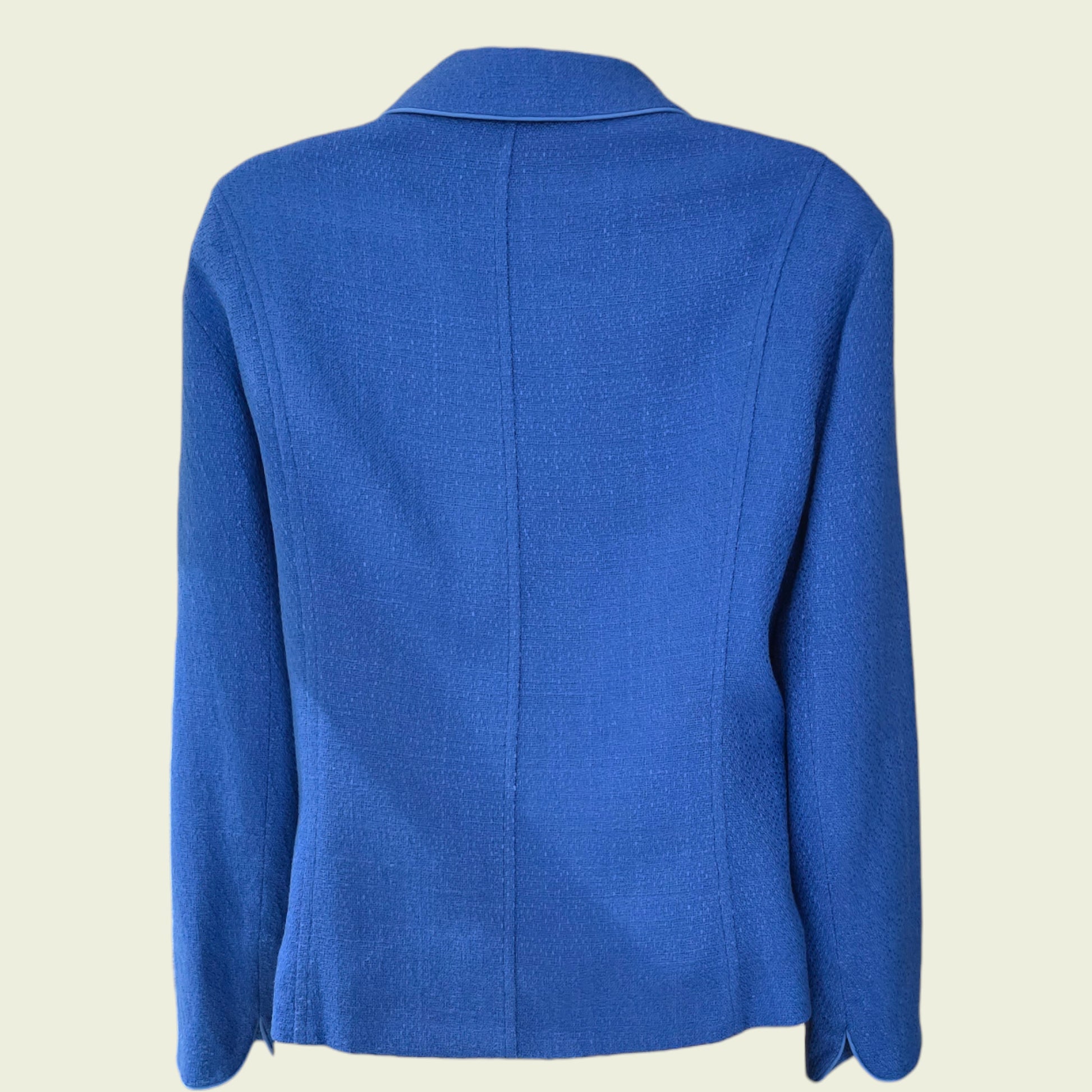 Blue jacket on a beige background