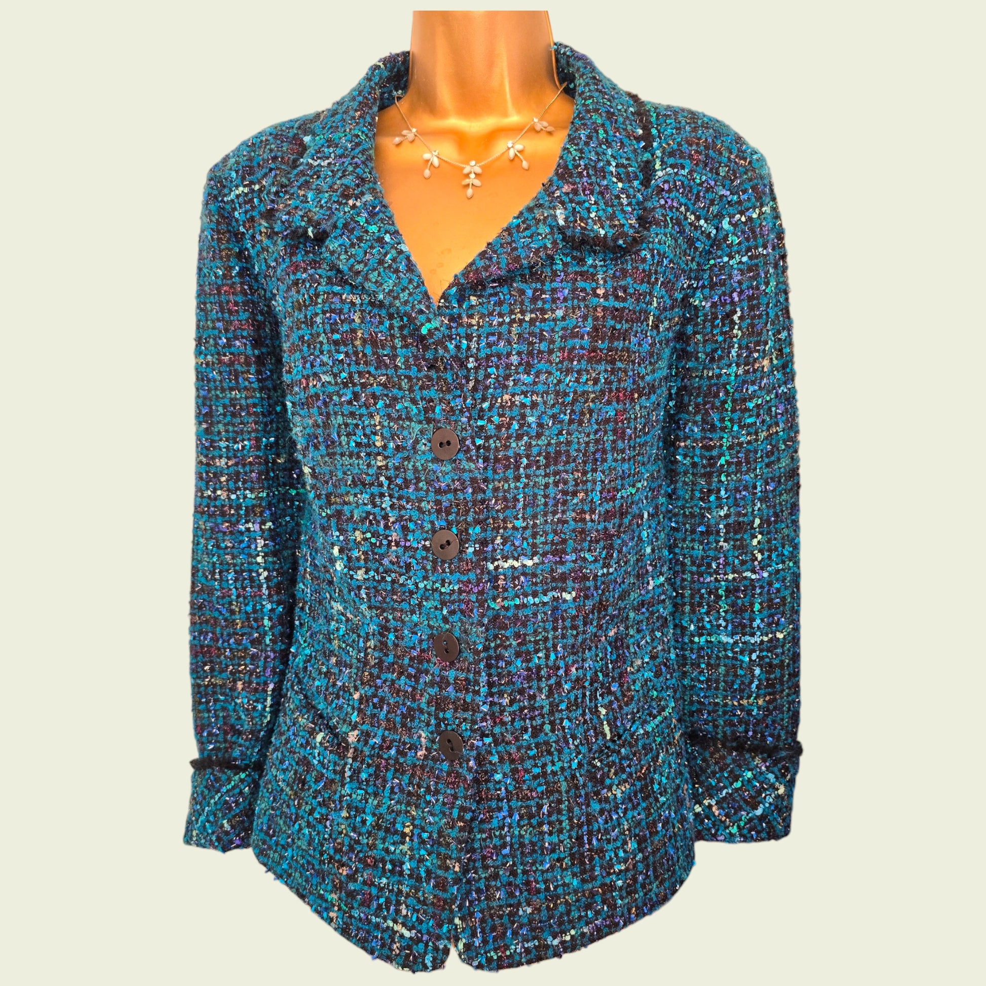 Multicolored textured jacket on a mannequin against a plain background