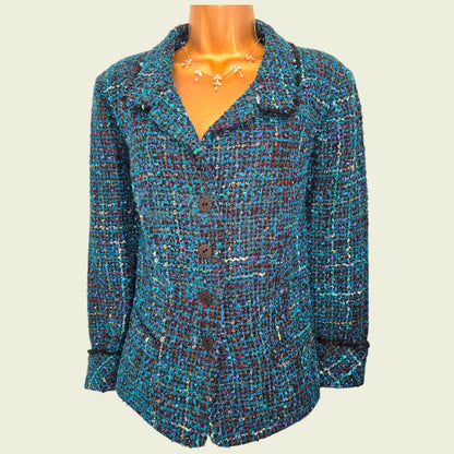 Multicolored textured jacket on a mannequin against a plain background