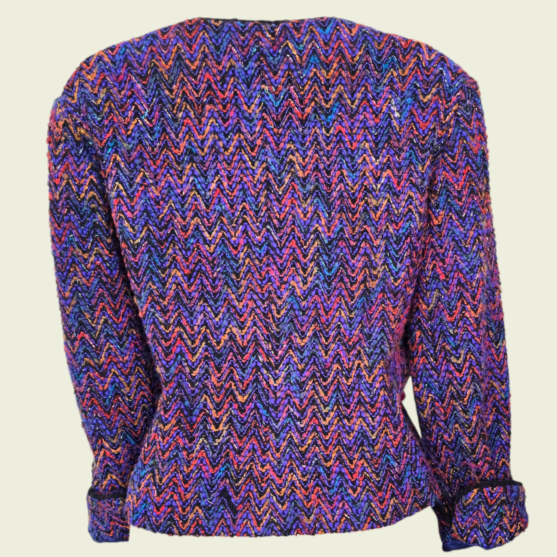 Multicolored zigzag patterned jacket on a beige background