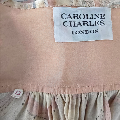 Clothing label with 'Caroline Charles London' on a garment.