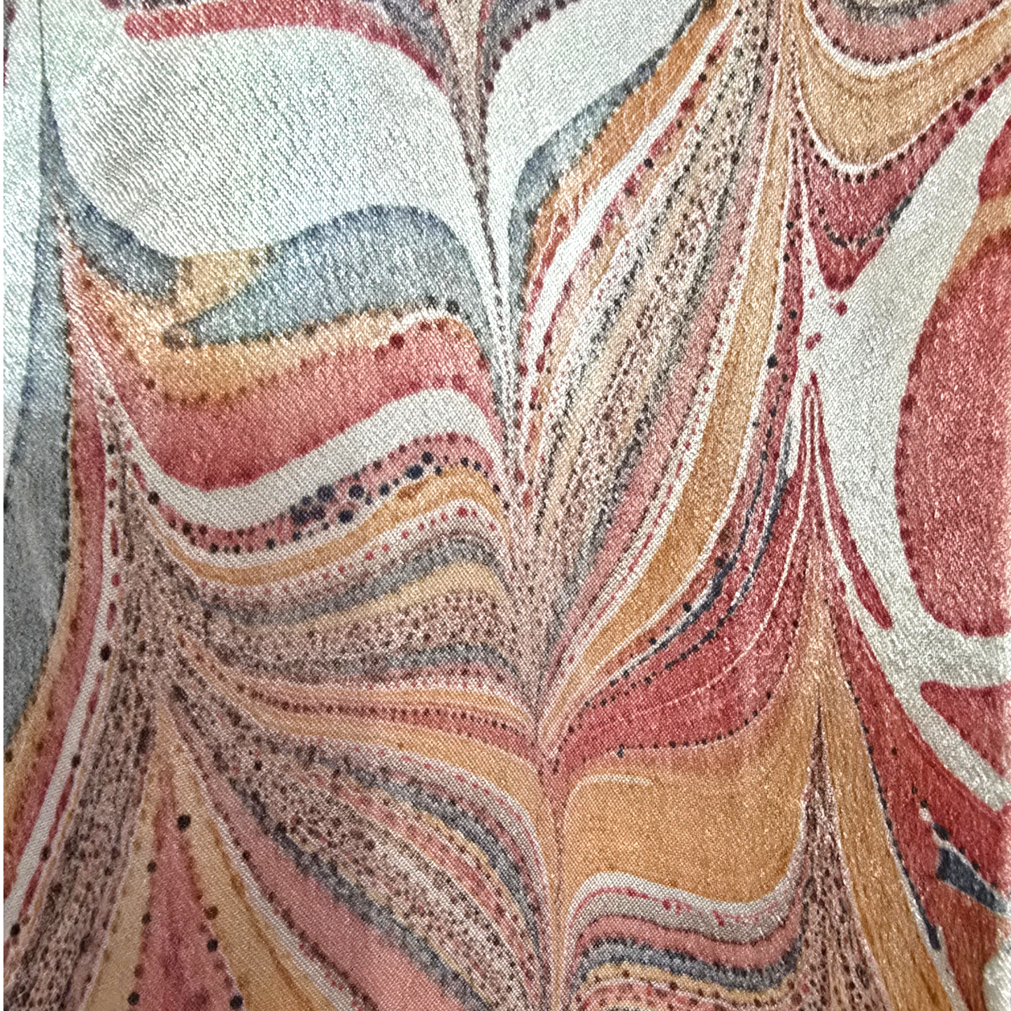 Close-up of fabric with a multicolored, marbled pattern
