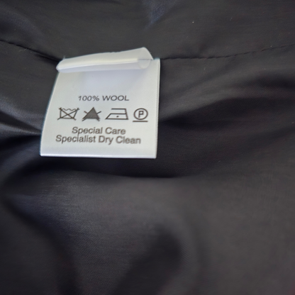 Wool label on a dark fabric background