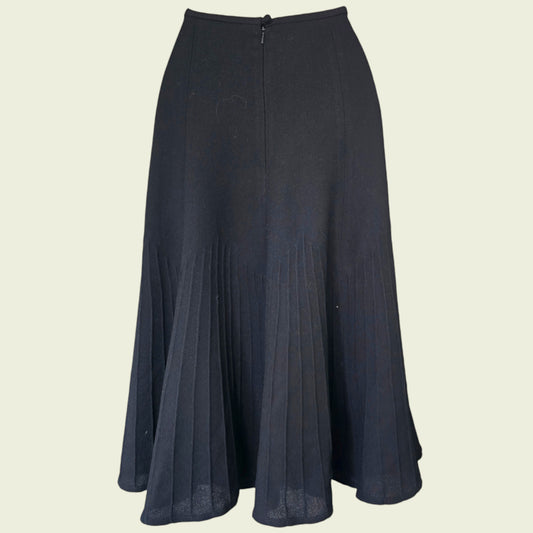 black skirt on a beige background