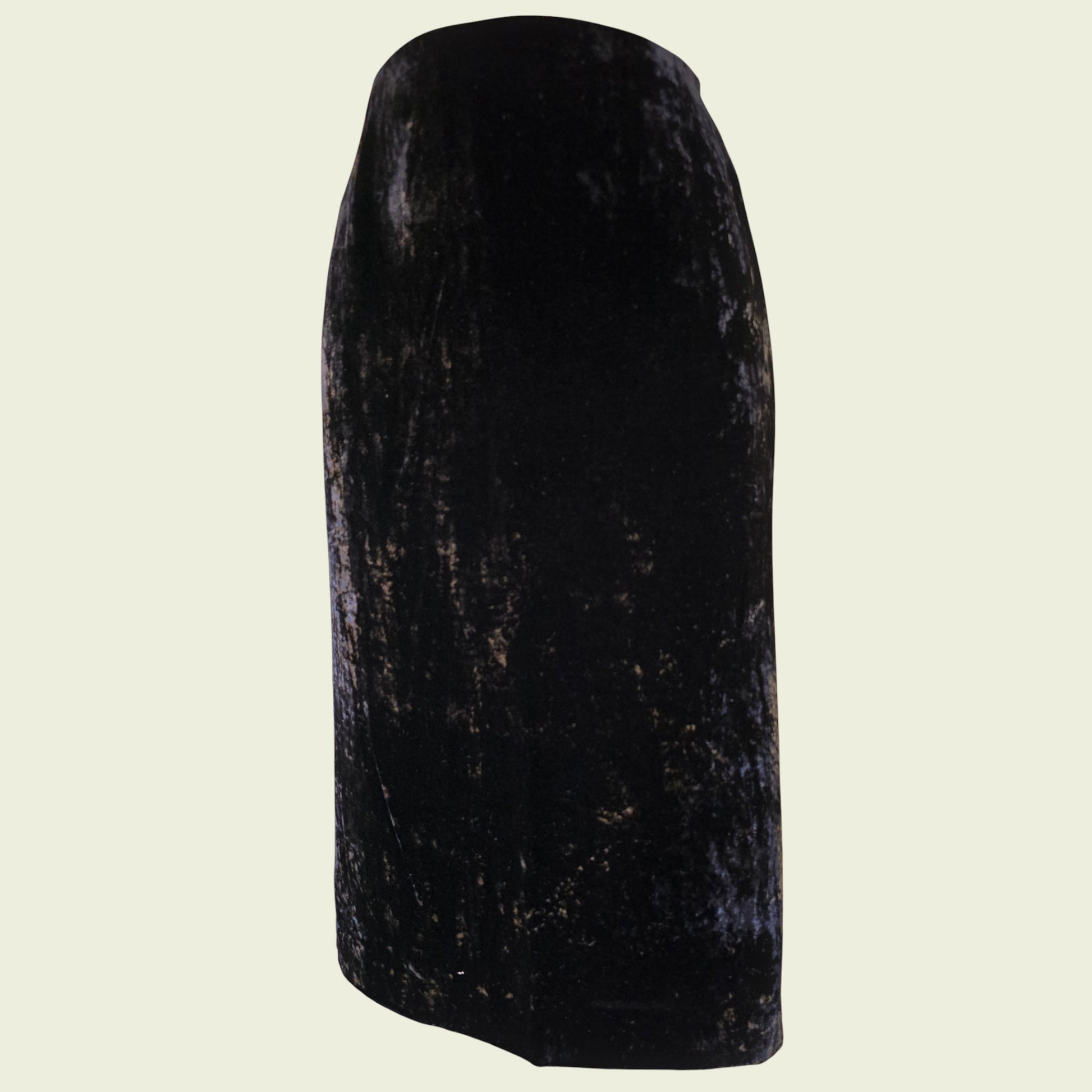 Black velvet pencil skirt on a beige background