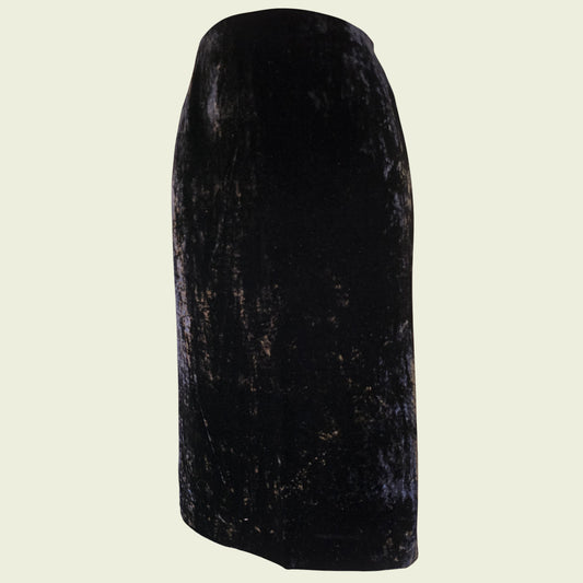 Black velvet pencil skirt on a beige background