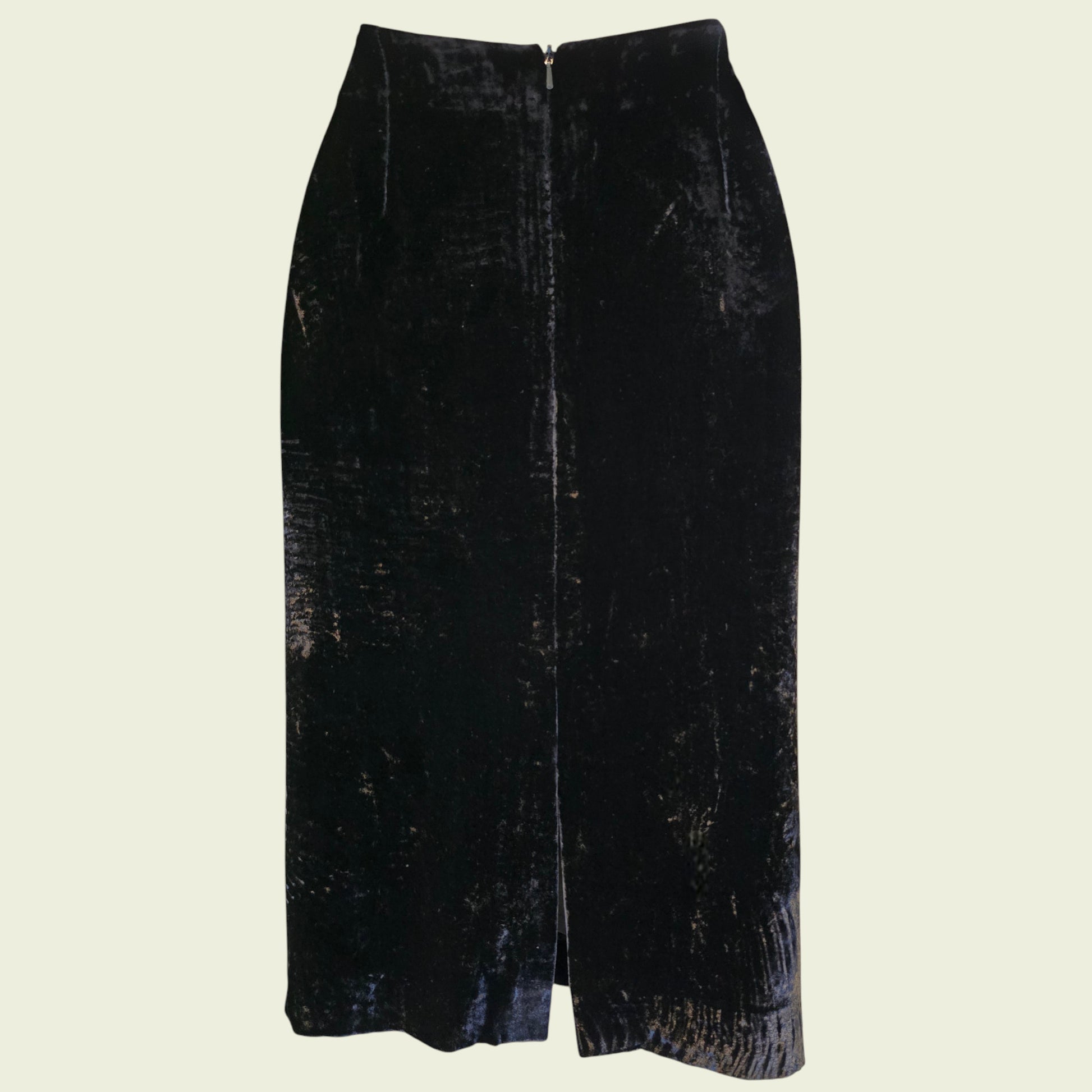 Black velvet skirt on a beige background