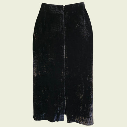 Black velvet skirt on a beige background