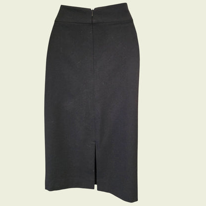 Black pencil skirt on a light beige background