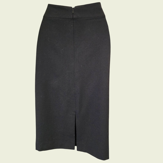 Black pencil skirt on a light beige background