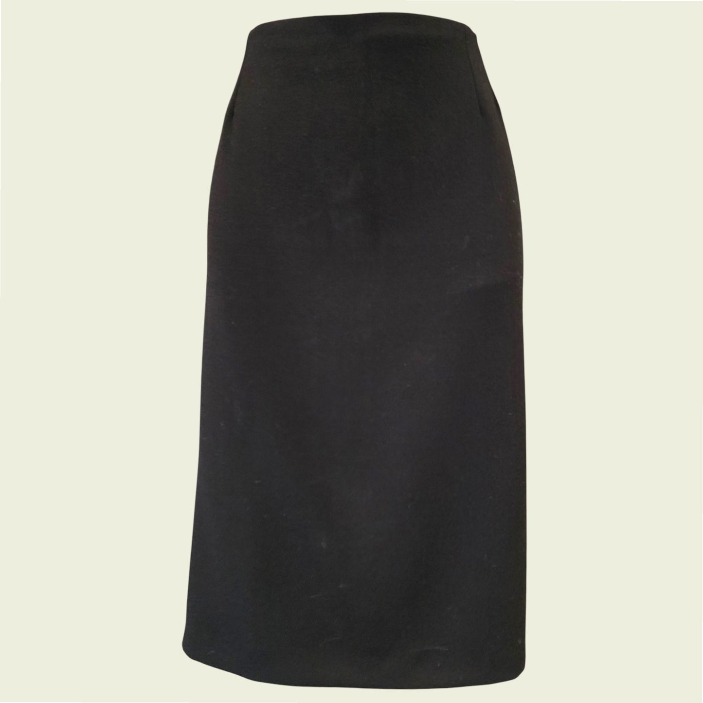 Black skirt on a beige background