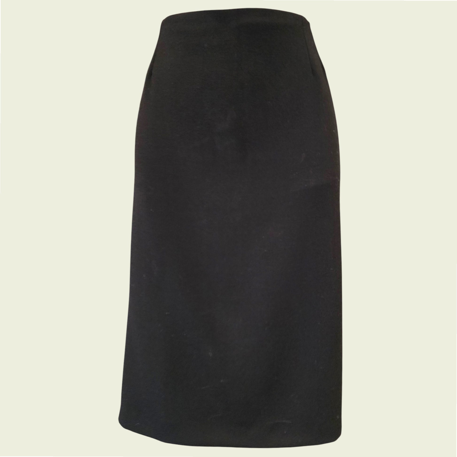 Black skirt on a beige background