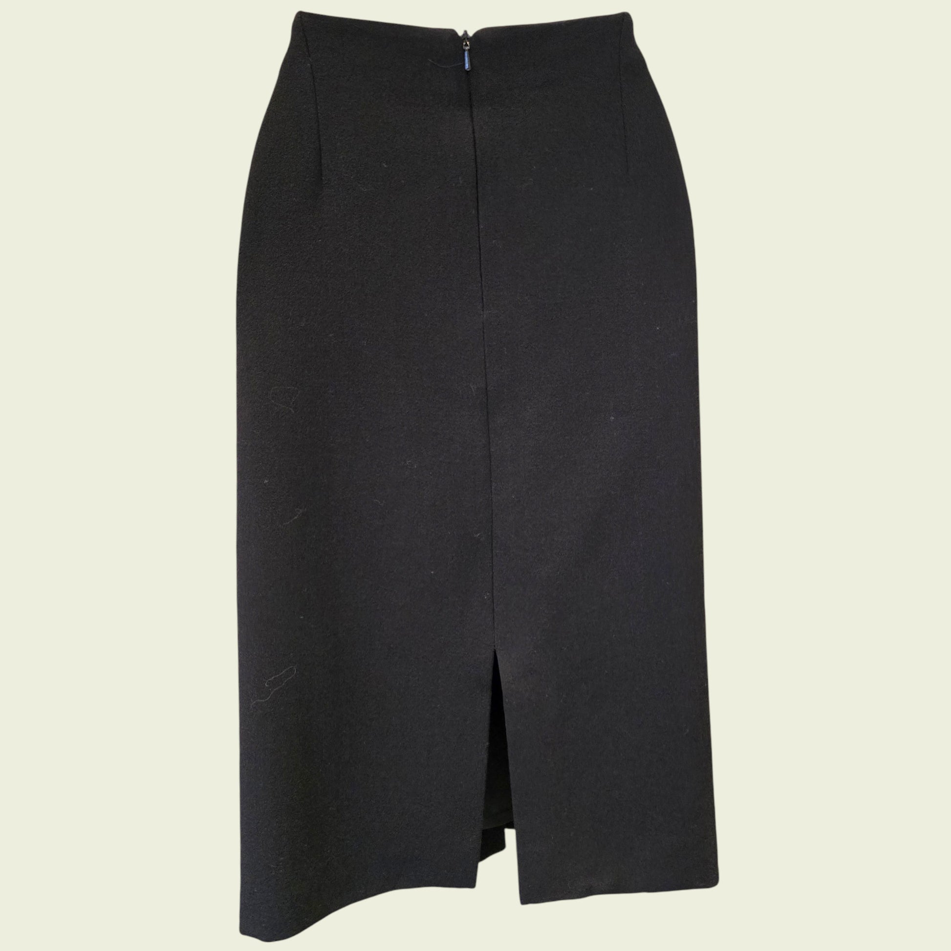 Black pencil skirt on a beige background
