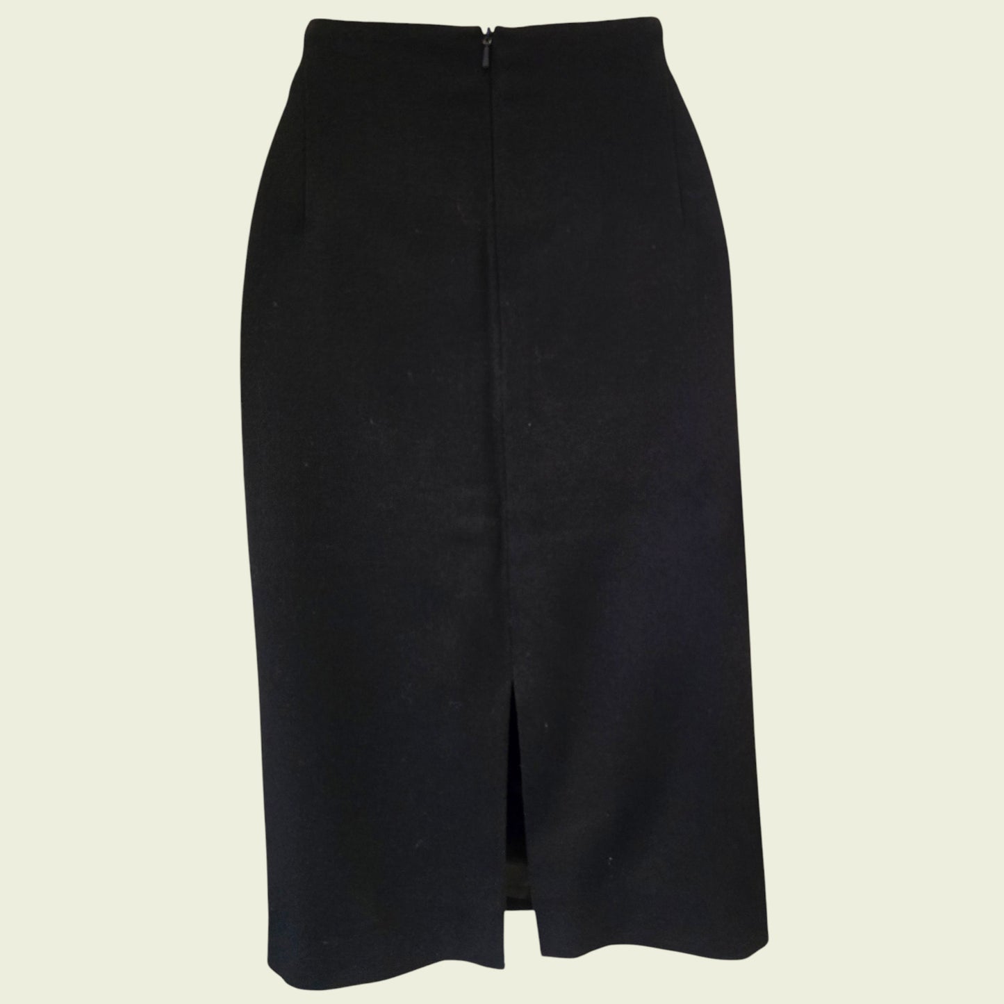 Black pencil skirt on a beige background
